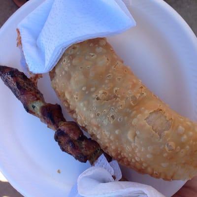 Empanada and bbq pork on a stick