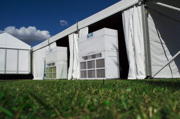 Some of our vertical HVAC units being set up at an outdoor tented concert hall.