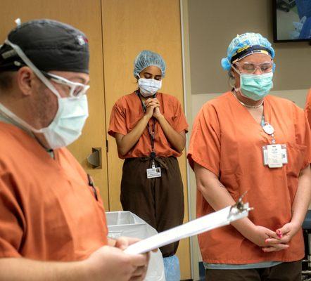 A moment of silence before starting tissue donation surgery