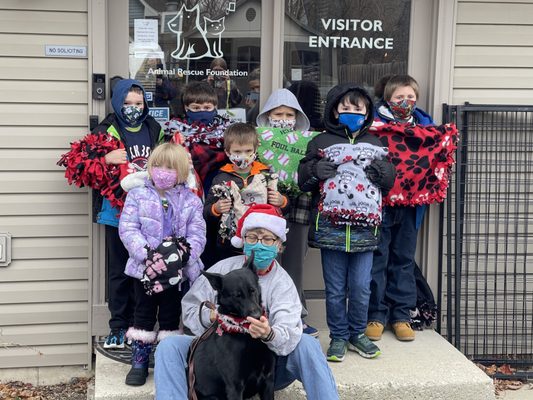 Community members make blankets for pets to go with them to their forever homes.