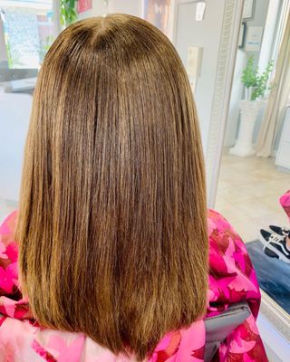 Silk press and trim on damaged hair.