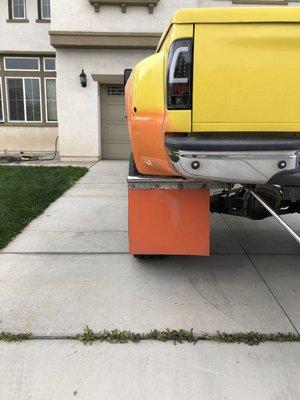 Back view of the driver side rear fender compare tire showing to passenger side