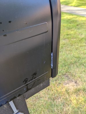 Residue from business card left wedged on our mailbox