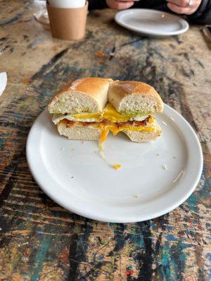 BEC on a plain bagel with Cheddar Cheese and Avocado.