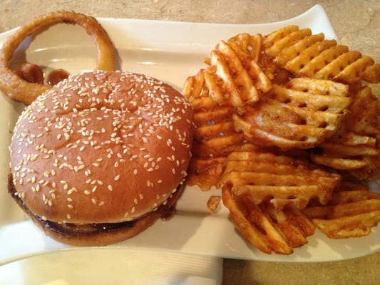 Barbecue burger with onions on the side.