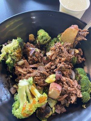 Shredded beef with roasted potatoes, broccoli, Brussels sprouts and onions.