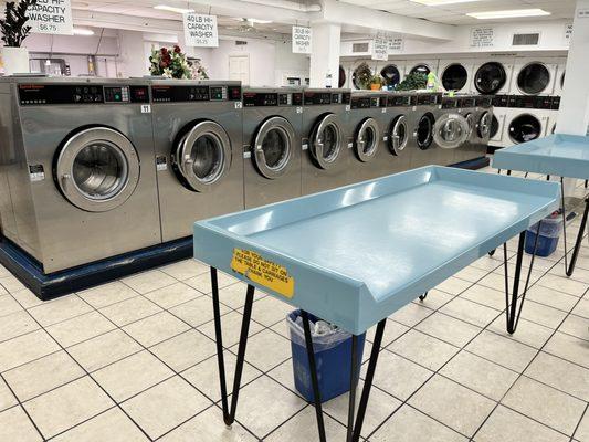 Folding table between washers and dryers.