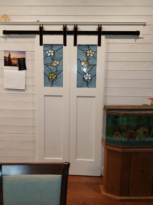 Custom made barn doors and nickel gap wall.