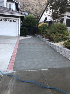 The new extended driveway with block wall.