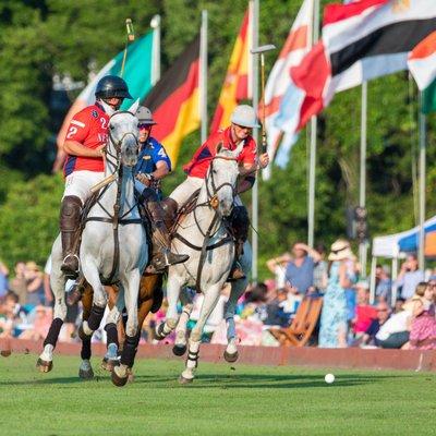 Newport carries the ball as onlookers watch from reserved Tailgates during a Newport International Polo Series public exhibition match.