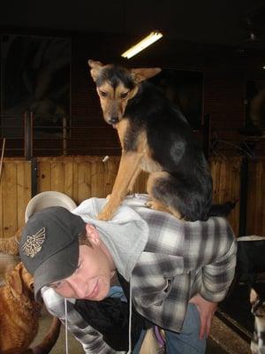 My dog with one of his favorite people at day care! Picture taken by Spot.