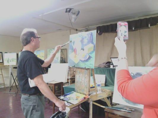 Don Sahli, giving a painting demonstration on still life.