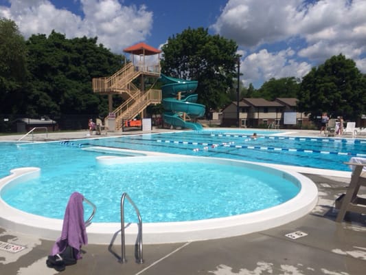 Lap pool with water slide in background