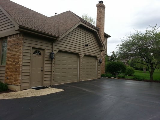 Insulated doors painted and installed to compliment the appearance of the home.