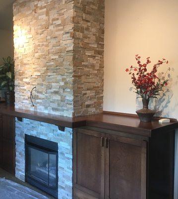 Classic flagstone tile gives this fireplace a timeless look that will never go out of style.