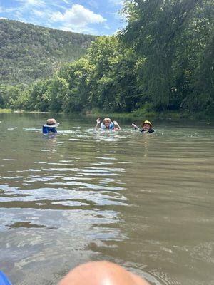 The next generation River Rats swimming in the Guadalupe in July 2024 on a Little Ponderosa 4 hour tubing adventure.