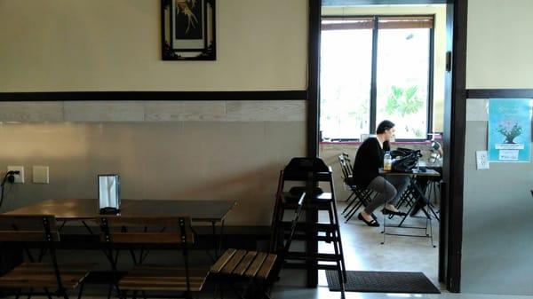 Seating area and doorway to store next door