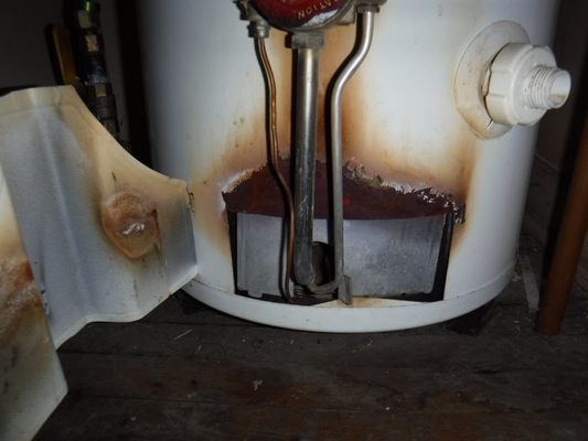 flame roll-out at an old water heater