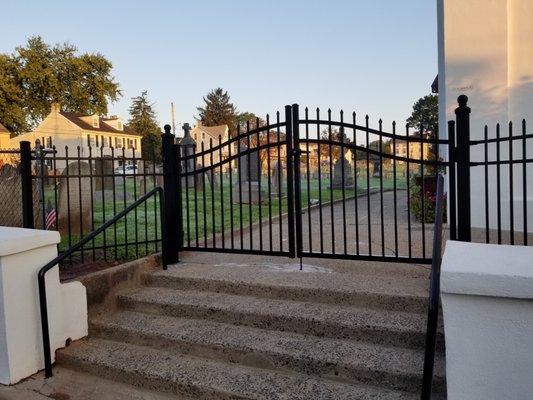 This double drive aluminum gate is installed at a local church in Phoenixville, it features a solid bottom rail with exposed top spears