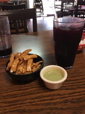 Refreshing chicha morada and fried  wantan with green salsa dip