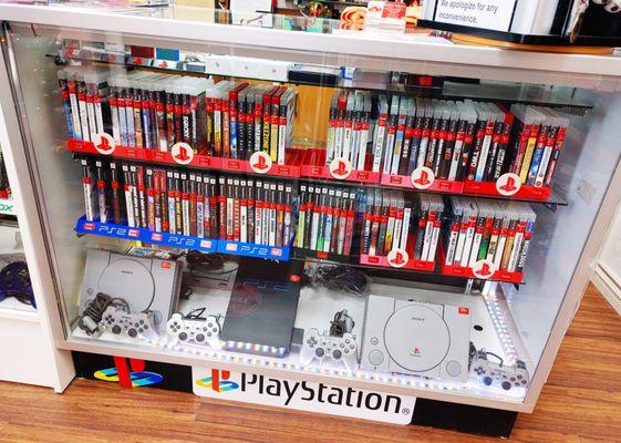 Selection of used video consoles and video games.