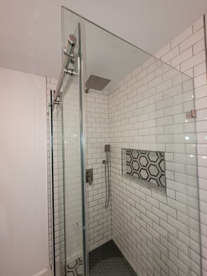 Dreamline shower door on custom tile shower with tile niche