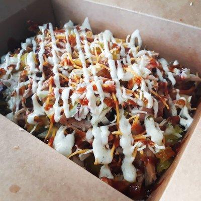 Barbecue Garbage Fries with slow smoked pork and the works.