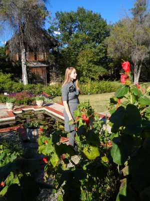 My daughter at Weston Gardens in Bloom. WGIB does NOT sell Monarch-killing Asclepias curassavica, only good milkweed.