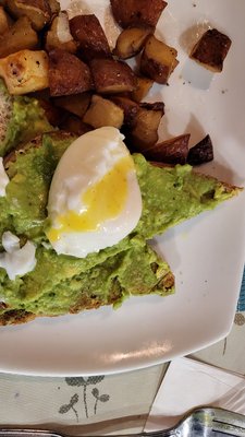 Avocado toast and poached eggs with home fries!