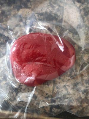 a red sparkly putty slime