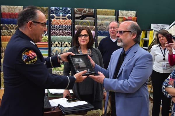 FDNY presenting a steel piece from the World Trade Center in a shadowbox as a Thank You for participating in Building for America's Bravest