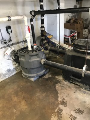 Grinder pump installation and above ground grease interceptor.