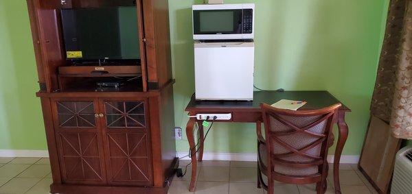 Refrigerator and microwave in all rooms.