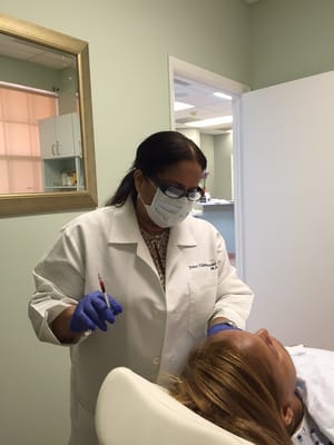 Dr. Villaman performing a Palette Rich Plasma (PRP)treatment. Also known as the "Vampire Facial"