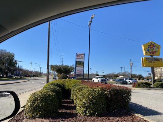 Street access to MD Phone Repair, beside Sky Nails and Church's Chicken.