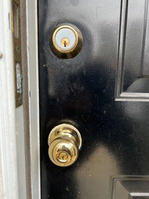 black door with door knob and deadbolt standard