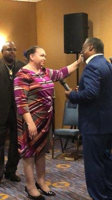 Lady Bessie Pickett receiving a word from our own Bishop Anthony L Willis of PURE Ministries