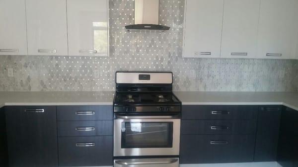 White quartz countertop  with marble mosaic backsplash