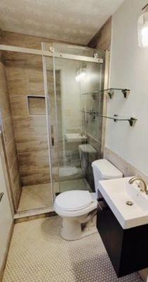 Refinished Bathroom . We do renovations, full guts & whatever you want we can do it.  Need design help - we provide that too!