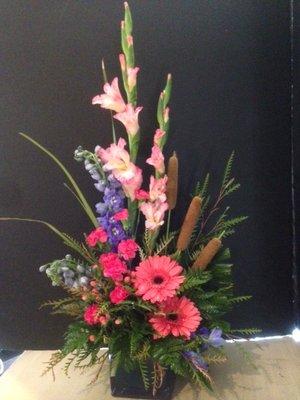 Gorgeous fresh arrangement with Gerber daisies made by one of our talented designers