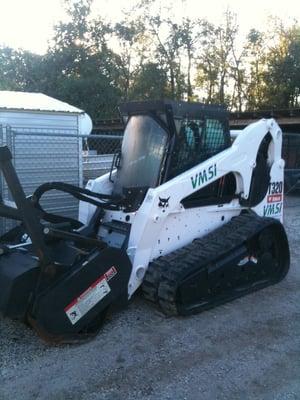 Bobcat with Forestry Head for Brush and Small Tree Clearing