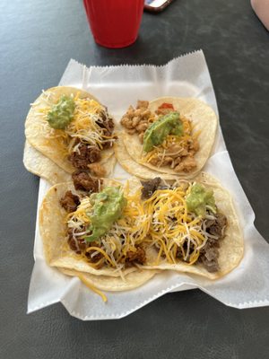 Top right going clockwise: Chicken, beef, Al Pastor, beef Birria tacos