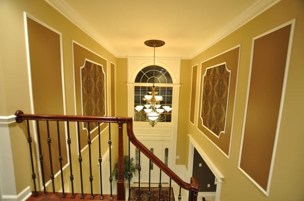 Foyer Picture Frames and Front Door trim. Also custom painting.