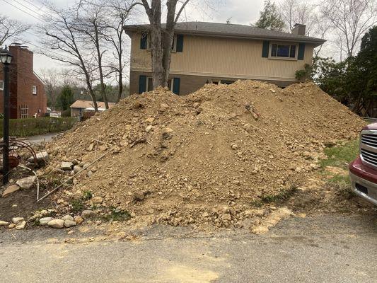 the contractor Ken Bentone decided to spread the clay and rocks all around my front lawn, completely killing the grass.