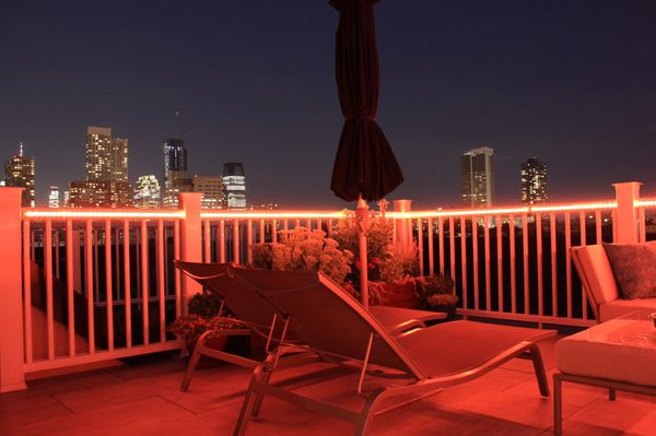 Custom color changing rope lighting on this Jersey City Rooftop Deck