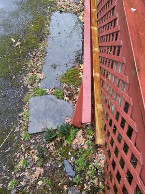 Wood slats with nails sticking out that he left behind for us to deal with