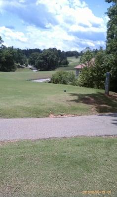 View of the par 4 14th from back tee w/13th fairway on left. You actually have to hit tee shot over the roof of that house!