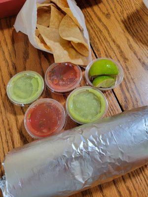 Carne asada burrito with chips and salsa