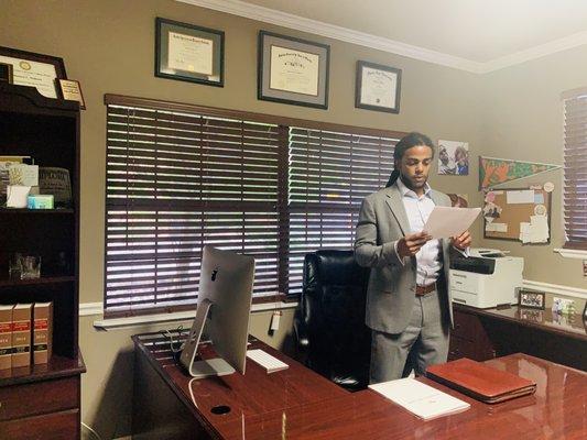 Attorney Williams reviewing some documents prior to heading to the Florida Department of Law Enforcement to  meet  with Special Agents.