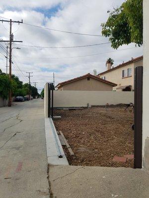 RV access with 20' Gate rolled back, post removed, pedestrian gate open.